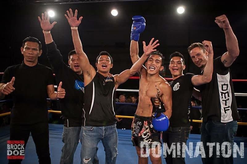 Surasak celebrating a win with his corner
